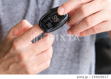 A device to measure the oxygen saturation of a person at the fingertips. And checking oxygen depletion is an emergency sign of pneumonia caused by the COVID-19 virus. 134826617
