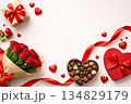 Valentine's Day gifts: red heart shapes, chocolate box, roses and ribbon on a soft pastel background.Top view. Copy space 134829179