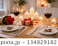 romantic Valentine's Day dinner at home, candles, wine glasses, simple table setting 134829182