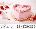 Valentine's pink heart-shaped cake decorated with strawberries on pink background 134829185