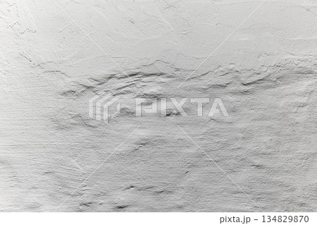 White plaster wall texture with horizontal relief, soft shadows and minimal neutral background. Copy space White plaster wall texture with horizontal relief, soft shadows and minimal neutral background. Copy space 134829870