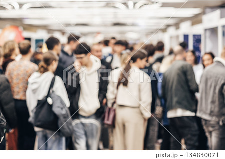 Abstract blurred people at exhibition hall of expo event trade show. Business convention show or job fair. Business concept background. 134830071