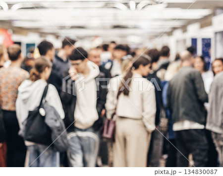 Abstract blurred people at exhibition hall of expo event trade show. Business convention show or job fair. Business concept background. 134830087