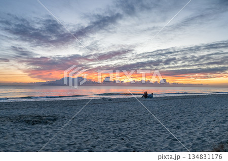 sunrise romantic couple on Corsican coast near Bastia Etang de Biguglia Camping San Daminao Beachside Corse 134831176