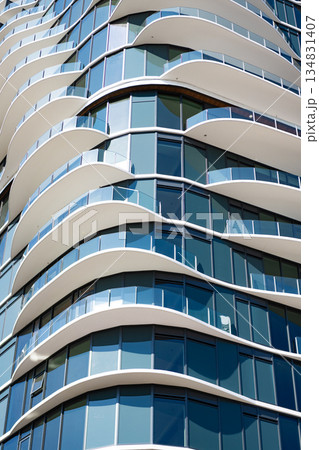 Architectural design. Building exterior architecture. Building background. Glass building design. Architectural detail. Background of architecture. Modern glass background. Glass exterior background Architectural design. Building exterior architecture. Building background. Glass building design. Architectural detail. Background of architecture. Modern glass background. Glass exterior background 134831407
