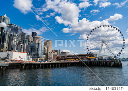 Seattle, Washington, USA, July 26, 2024: Ferris wheel. Amusement park with Ferris wheel. Observation Ferris wheel. Fairground ride on observation wheel. Entertainment park. Copy space Seattle, Washington, USA, July 26, 2024: Ferris wheel. Amusement park with Ferris wheel. Observation Ferris wheel. Fairground ride on observation wheel. Entertainment park. Copy space 134831474