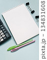 Notebook with calculator and pens on a blue background 134831608