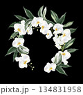 Wedding wreath with white flowers and green orchid leaves. 134831958