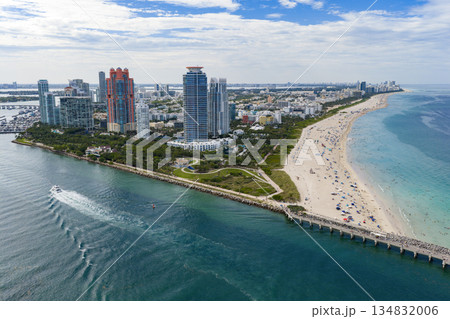 Luxury yacht cruising near Miami skyline. Aerial view of boats on turquoise waters in Miami. Yacht retreat in South Florida Miami. Luxury yacht cruising near Miami skyline. Aerial view of boats on turquoise waters in Miami. Yacht retreat in South Florida Miami. 134832006