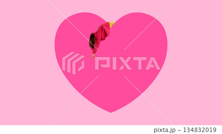 Conceptual design with woman falling into pink heart. Conceptual design with woman falling into pink heart. 134832019