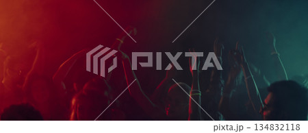 Abstract motion of dancing hands in colorful light haze. Banner 134832118