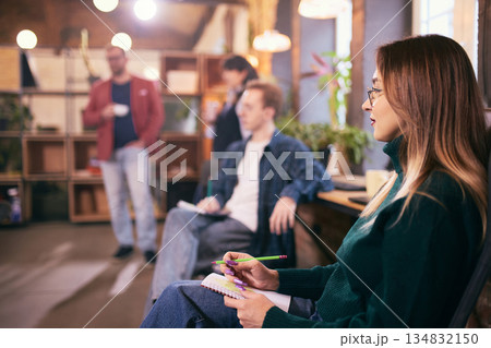 Casual team meeting in modern open space office. 134832150