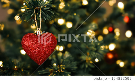 Red Heart Ornament on Christmas Tree with Warm Lights 134832593