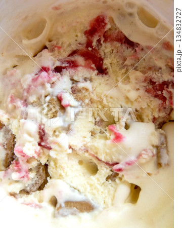 Close up of white and red ice cream, ice cream with strawberries jam and chocolate, macro, closeup. High quality photo 134832727