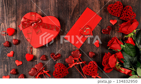 Celebration of Valentine's Day or Women's Day, Mother's Day, banner. Greeting card, roses, hearts and gift boxes on a wooden background, happy holiday, birthday greetings, selective focus 134832950