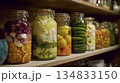 Farmhouse Style Jars Contain Preserved Vegetables Illuminated By Cozy Ambient Lighting With Rustic Labels 134833150