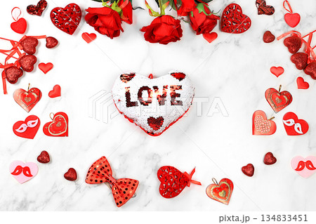 Valentine's Day or Women's Day, Mother's Day concept, banner. Greeting card, red hearts and roses on marble background, happy holiday, birthday greetings, selective focus 134833451
