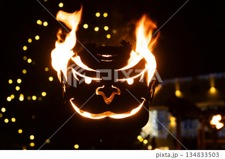 Krampus Festival in Europe. Burning head, blazing flame at night. Krampus Festival in Europe. Burning head, blazing flame at night. 134833503