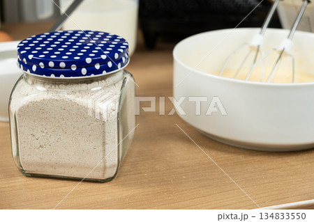 Whole wheat flour in a glass jar for making homemade healthy dough. Whole wheat flour in a glass jar for making homemade healthy dough. 134833550