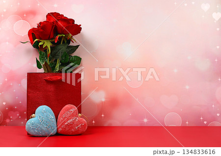 Concept for Valentine's Day or Women's Day, Mother's Day, banner. Greeting card, roses, hearts and gift boxes on a red background, happy holiday, birthday greetings, selective focus 134833616