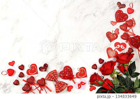 Greeting card with roses, hearts and gift boxes on light background.Concept for Valentine's Day or Women's Day, Mother's Day, banner, happy holiday, birthday greetings, selective focus 134833649