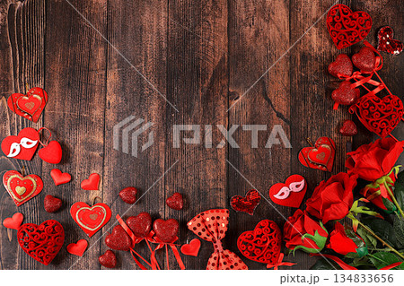 Greeting card with roses, hearts and gift boxes on wooden background.Concept for Valentine's Day or Women's Day, Mother's Day, banner, happy holiday, birthday greetings, selective focus 134833656