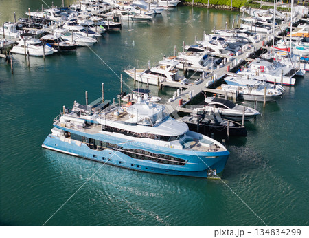 Yacht club and marina. Luxury marina with private yacht and boat. Docked yacht boat in harbor. Luxury summer vacation in sea. Private boat top view. Marina with luxury sea boat 134834299