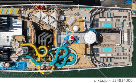 Ship top view. Luxury liner resort. Cruise ship voyage. Entertainment deck. Paradise on board. Aerial top of cruise in summer vacation. Cruise ship tour and travel at sea. Aerial luxury liner voyage Ship top view. Luxury liner resort. Cruise ship voyage. Entertainment deck. Paradise on board. Aerial top of cruise in summer vacation. Cruise ship tour and travel at sea. Aerial luxury liner voyage 134834300