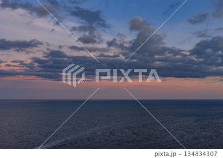 Sea horizon view. Cloudy sky and seascape at summer vacation. Skyscape with sea horizon. Calm horizon with sea nature. Romantic summer vacation at seascape. Sunset sea and seascape. Ocean paradise 134834307