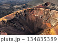 A beautiful view of a volcano crater, desert, mountains and volcanoes on the Lanzarote island. 134835389