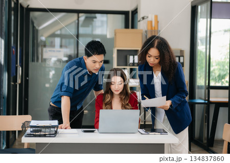 Office colleagues have a casual discussion. During a meeting in a conference room, a group of business teem sit in the conference room Office colleagues have a casual discussion. During a meeting in a conference room, a group of business teem sit in the conference room 134837860