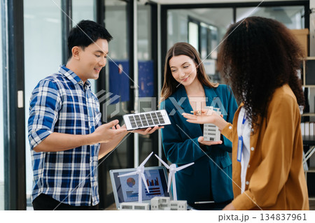 Discussion among businesspeople on the latest developments in solar cell panel technology and Solar Energy Environment city Concept. 134837961
