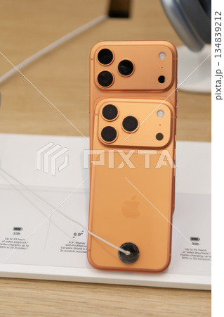 Miami, Florida, USA - October 01, 2025: iPhone 17 pro max presentation. iPhone 17 pro max orange. Digital device store with smartphone Apple. Company Apple store with iPhone. Phone on display Miami, Florida, USA - October 01, 2025: iPhone 17 pro max presentation. iPhone 17 pro max orange. Digital device store with smartphone Apple. Company Apple store with iPhone. Phone on display 134839212