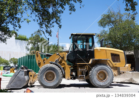 Heavy equipment of compact wheel loader with hydraulic system. Wheel loader heavy machinery outdoor. Industrial heavy equipment. Compact wheel loader machinery. Compact wheel loader 134839304