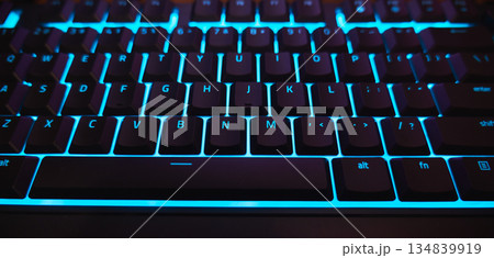 Backlit Gaming Keyboard with Cyan Blue LED Light Close-up. High quality photo Backlit Gaming Keyboard with Cyan Blue LED Light Close-up. High quality photo 134839919