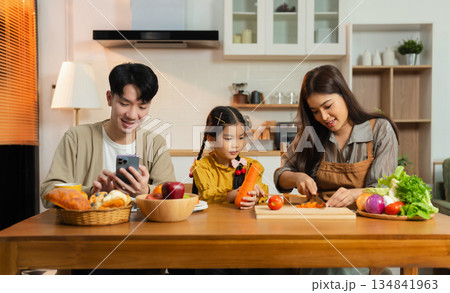 Family Asian spending happy time together on vacation, daughter homework on holiday. Family Asian spending happy time together on vacation, daughter homework on holiday. 134841963