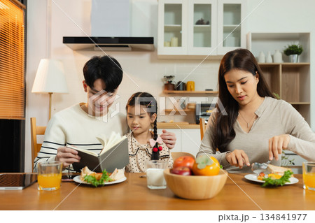 Family Asian spending happy time together on vacation, daughter homework on holiday. 134841977