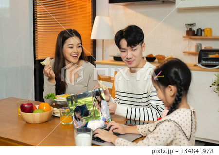 Family Asian spending happy time together on vacation, daughter homework on holiday. 134841978