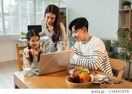 Family Asian spending happy time together on vacation, daughter homework on holiday. Family Asian spending happy time together on vacation, daughter homework on holiday. 134841979