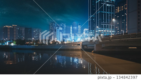 Serene Riverside Night View with Illuminated City Skyline and Reflections Serene Riverside Night View with Illuminated City Skyline and Reflections 134842397