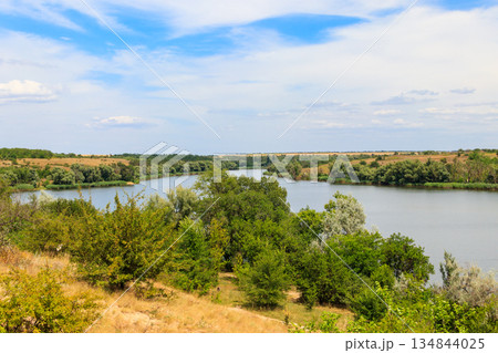 Summer landscape with beautiful river, green trees and blue sky Summer landscape with beautiful river, green trees and blue sky 134844025