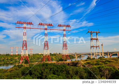 High voltage power line across the Dnieper river on Khortytsia island in Zaporizhia, Ukraine 134844039