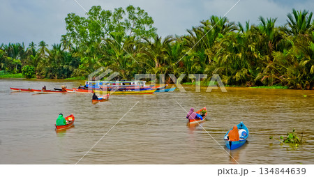 Beautiful view of Mertapura River floating market, South Kalimantan, Indonesia Beautiful view of Mertapura River floating market, South Kalimantan, Indonesia 134844639