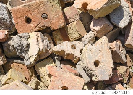 Construction debris from broken bricks close up 134845330