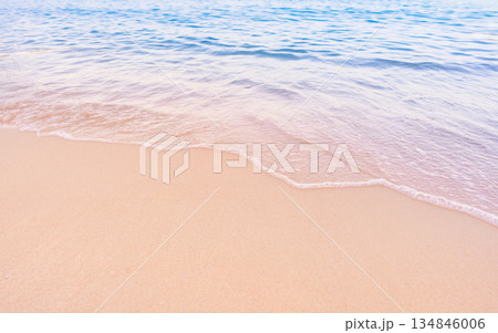 Soft blue ocean waves gently lapping onto a pristine tropical sandy beach Soft blue ocean waves gently lapping onto a pristine tropical sandy beach 134846006
