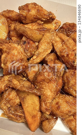 Crispy Korean fried chicken, perfectly glazed with a sweet and spicy sauce. Ideal for food photography and menus, showcasing the irresistible crunch and flavor of this beloved dish. Crispy Korean fried chicken, perfectly glazed with a sweet and spicy sauce. Ideal for food photography and menus, showcasing the irresistible crunch and flavor of this beloved dish. 134846690