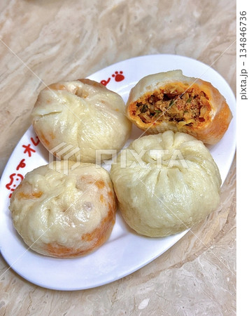 Jjinppang, soft and fluffy steamed buns filled with sweet red bean paste or savory fillings. A warm, comforting Korean snack perfect for any time of the day. Jjinppang, soft and fluffy steamed buns filled with sweet red bean paste or savory fillings. A warm, comforting Korean snack perfect for any time of the day. 134846736