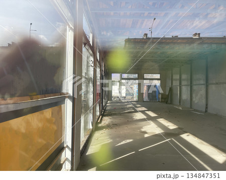 Empty weathered industrial building with sunny window 134847351