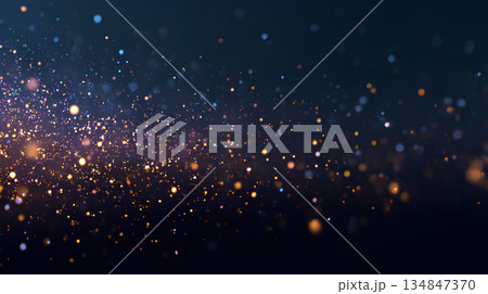 暗闇に舞う青と金の光の粒子背景 134847370