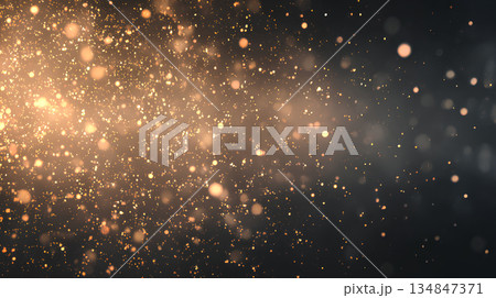 金色の光が広がる幻想的な粒子背景 134847371